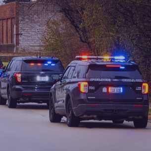 Lombard Police squad cars with emergency lights on 