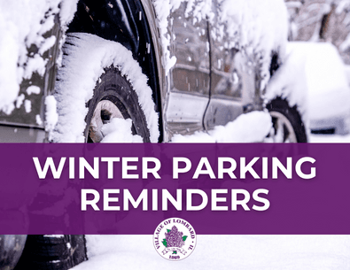 Cars parked in snow with text