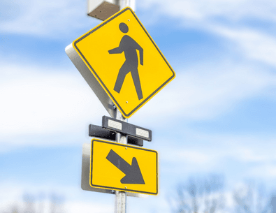 Flashing Crosswalk Sign and blue sky