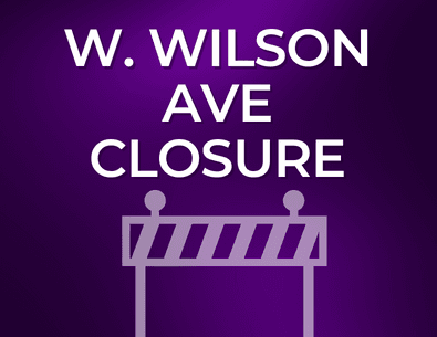 purple background with white text about road closure